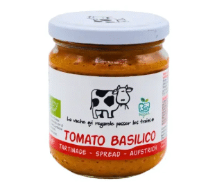 Bocal de tartinade "Tomato Basilico" de la marque Foodprint, avec illustration de vache. Saveur douce et méditerranéenne, idéale pour l’apéro ou les sandwichs | commercialisé par la boutique Tipi à Theux